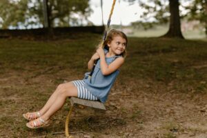 Kid swinging on a Tree Swing