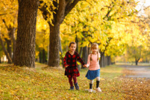 Kids playing under the trees